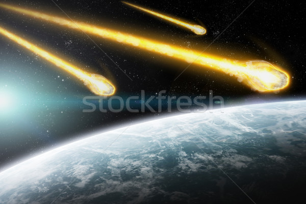 Asteroids over planet earth Stock photo © sdecoret