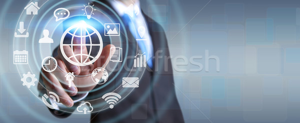 Businessman using digital tactile screen interface with web icon Stock photo © sdecoret