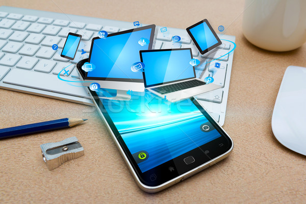 Modern mobiltelefon kapcsolódik tech eszközök iroda Stock fotó © sdecoret
