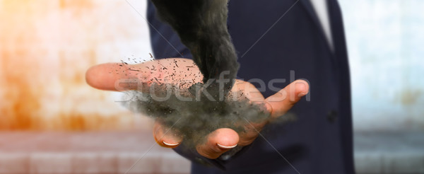 Stock photo: Man with tornado in his hand