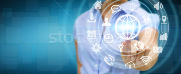 Businesswoman using digital tactile screen interface with web ic Stock photo © sdecoret