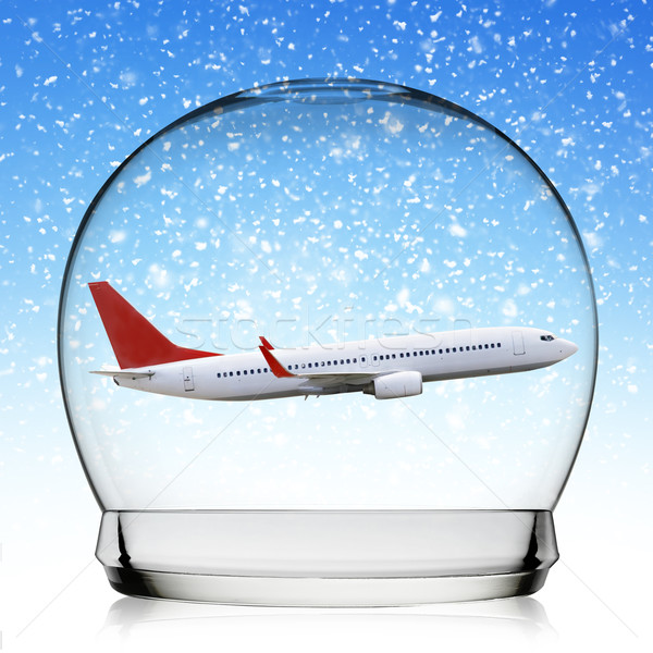 Plane flying in a snowball Stock photo © sdecoret