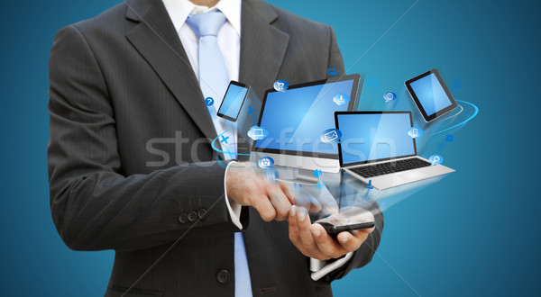 Businessman using modern mobile phone Stock photo © sdecoret