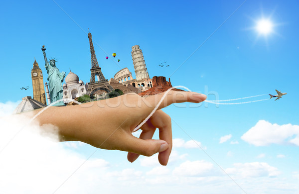 Monuments of the world on a woman hand Stock photo © sdecoret