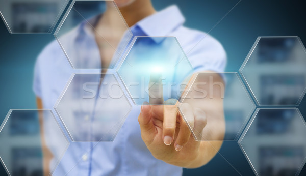 Businesswoman in his office using tactile interface Stock photo © sdecoret