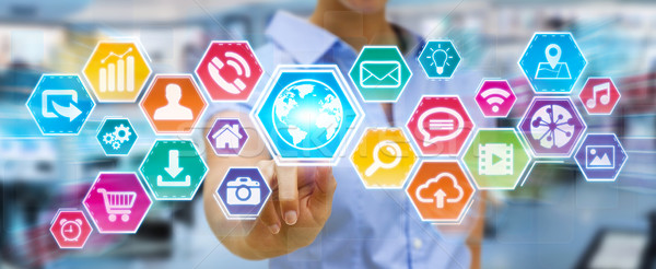 Businesswoman using digital tactile icons screen Stock photo © sdecoret