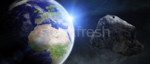 Bedreiging aarde vliegen sluiten zon wereld Stockfoto © sdecoret