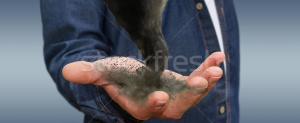 Férfi tornádó kéz fiatalember tart sötét Stock fotó © sdecoret