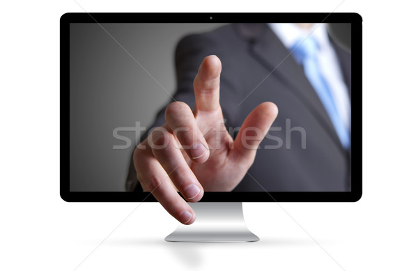 Businessman escaping from computer Stock photo © sdecoret