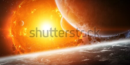 Stock photo: Exploding sun in space close to planet