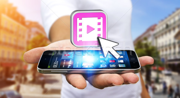 Fiatalember modern mobiltelefon óra videó kéz Stock fotó © sdecoret