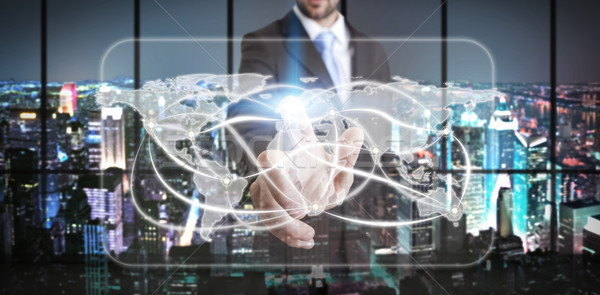 Businessman in his office using tactile interface Stock photo © sdecoret