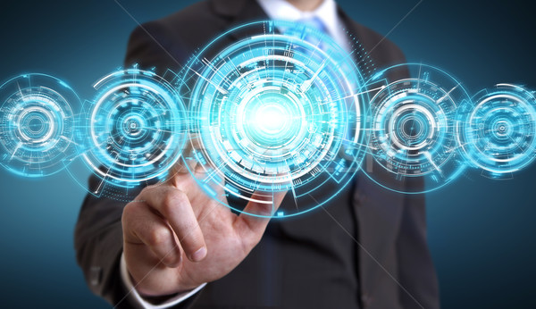 Businessman in his office using tactile interface Stock photo © sdecoret