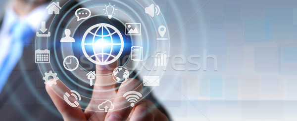 Businessman using digital tactile screen interface with web icon Stock photo © sdecoret