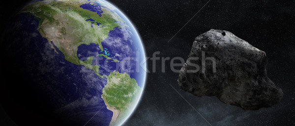 Asteroids threat over planet earth Stock photo © sdecoret