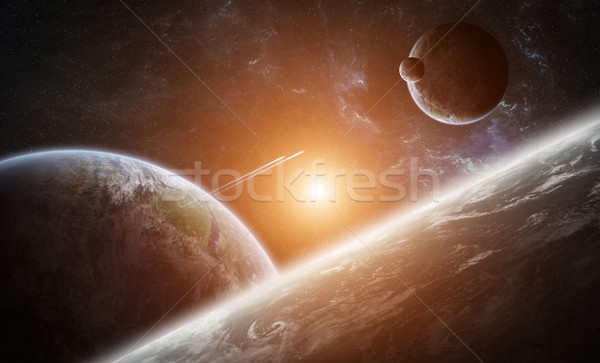 Sunrise over group of planets in space Stock photo © sdecoret