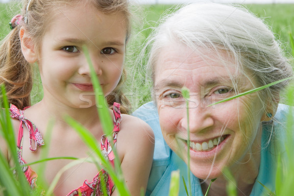 Stock photo: Girl and her grandmother in long grass