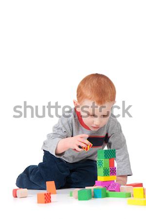 Boy building block tower Stock photo © sdenness