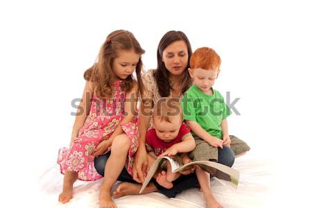 Anya olvas gyerekek anyu három fiatal Stock fotó © sdenness