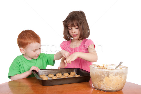 Kids counting chocolate chip cookies to bake Stock photo © sdenness