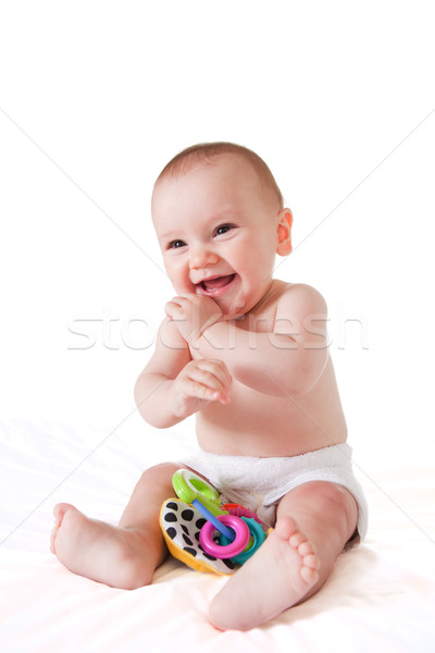 Stockfoto: Gelukkig · glimlachend · vergadering · baby · bed · speelgoed