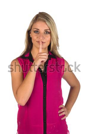 Young woman gesturing to keep quiteworking on a tablet Stock photo © serendipitymemories