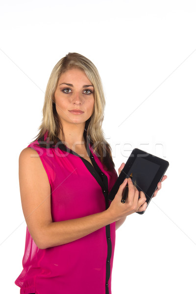 Młoda kobieta pracy tabletka patrząc kamery odizolowany Zdjęcia stock © serendipitymemories