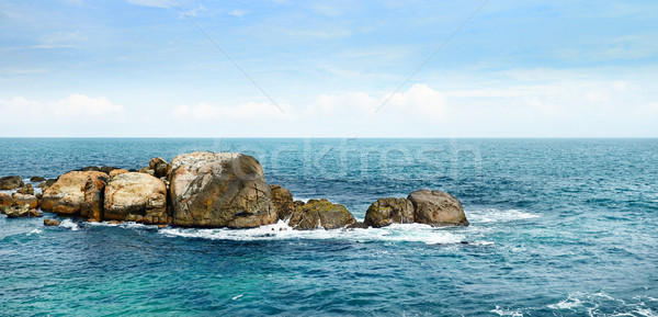 Stock photo: large rock in the ocean