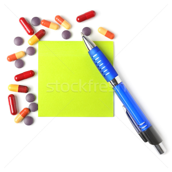 Medications, pen and paper for a prescription. Stock photo © serg64