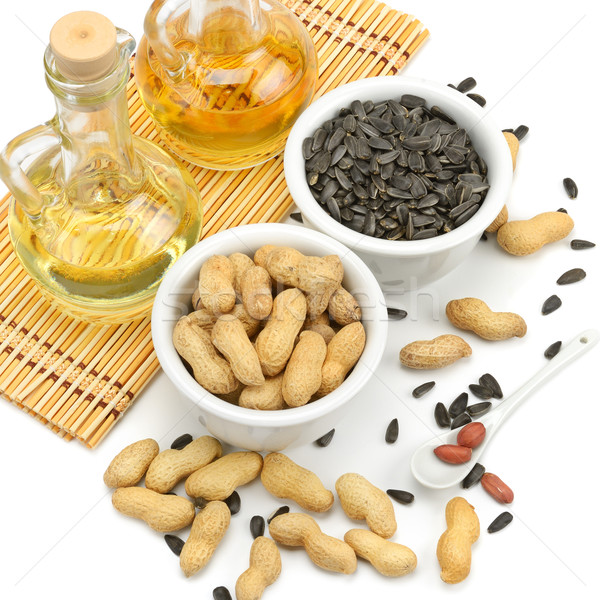 Sunflower seeds, peanuts and oil Stock photo © Serg64