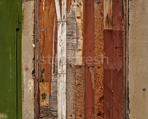 Aged damaged door made of various wooden materials Stock photo © serge001