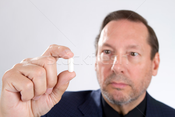 Man Holding Pill Capsule Stock photo © sframe