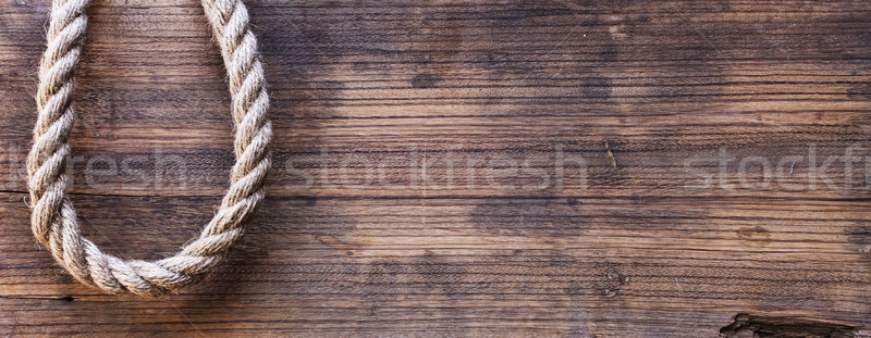 Stock photo: wooden board with a rough texture and a rope