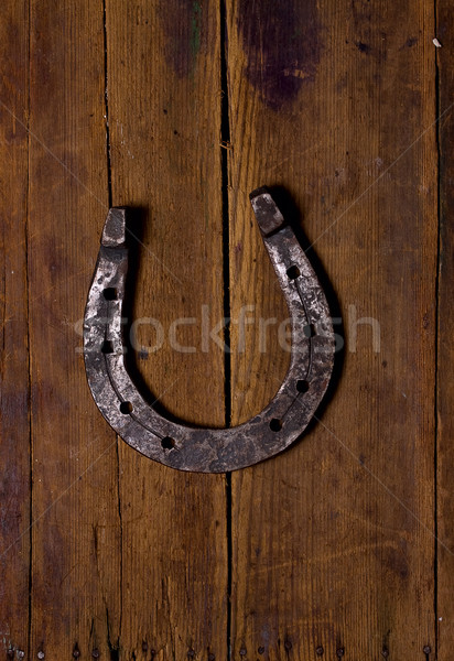 Stock photo: Wooden background and Horse Shoes