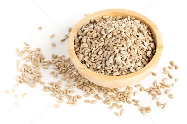 Stock photo: Shelled sunflower seeds in wooden bowl