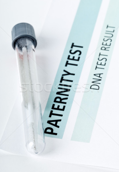 Stock photo: Paternity test result form with buccal swab in test tube