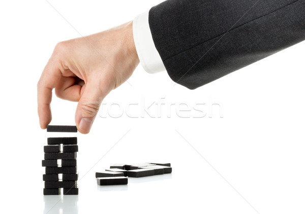 Milestone or progress concept - business man building domino tow Stock photo © ShawnHempel