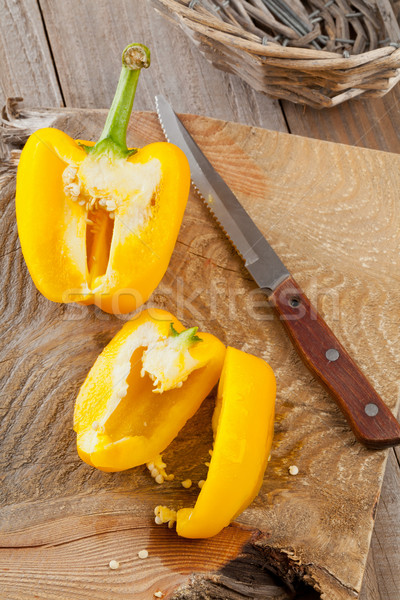 Preparing a yellow bell pepper on kitchen table Stock photo © ShawnHempel