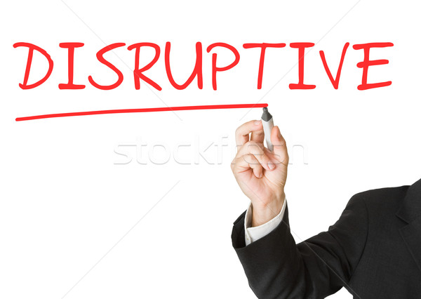 'Disruptive' written on whiteboard by businessman with marker Stock photo © ShawnHempel
