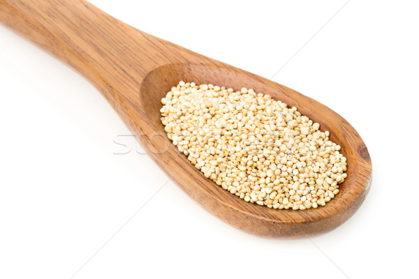 Raw, uncooked, whole quinoa seed in wooden spoon Stock photo © ShawnHempel