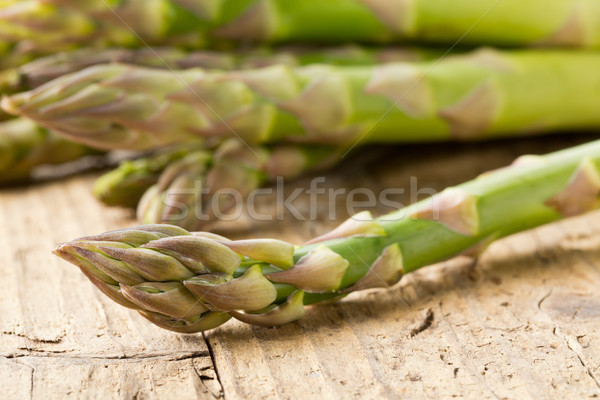 Stock photo: Bundle of fresh cut raw, uncooked green asparagus vegetable