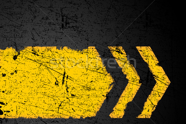 Grunge distressed yellow direction road marking on dark metal ba Stock photo © ShawnHempel