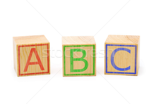 Stock photo: ABC letters on three brown wooden cubes lined up