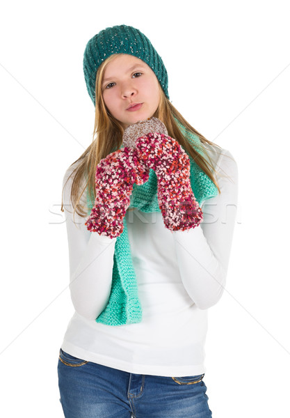 Young girl with white shirt, beanie and wooly gloves eating ging Stock photo © ShawnHempel