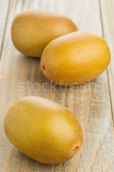 Three whole golden kiwifruit/ kiwi Stock photo © ShawnHempel