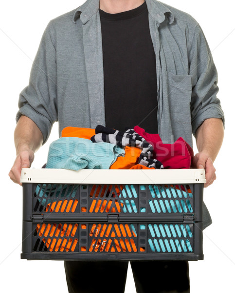 Stock photo: Man holding box with clothing donations
