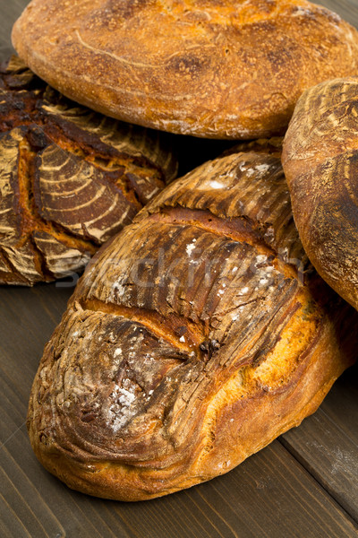 Hand made bread loaves on wooden table Stock photo © ShawnHempel