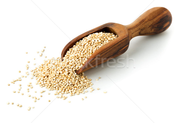 Raw, whole, unprocessed quinoa seed in wooden scoop on white Stock photo © ShawnHempel