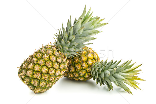 Two whole pineapple fruit on white background Stock photo © ShawnHempel