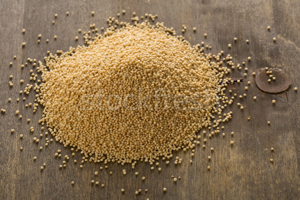 Heap of raw amarath seeds on wooden board Stock photo © ShawnHempel